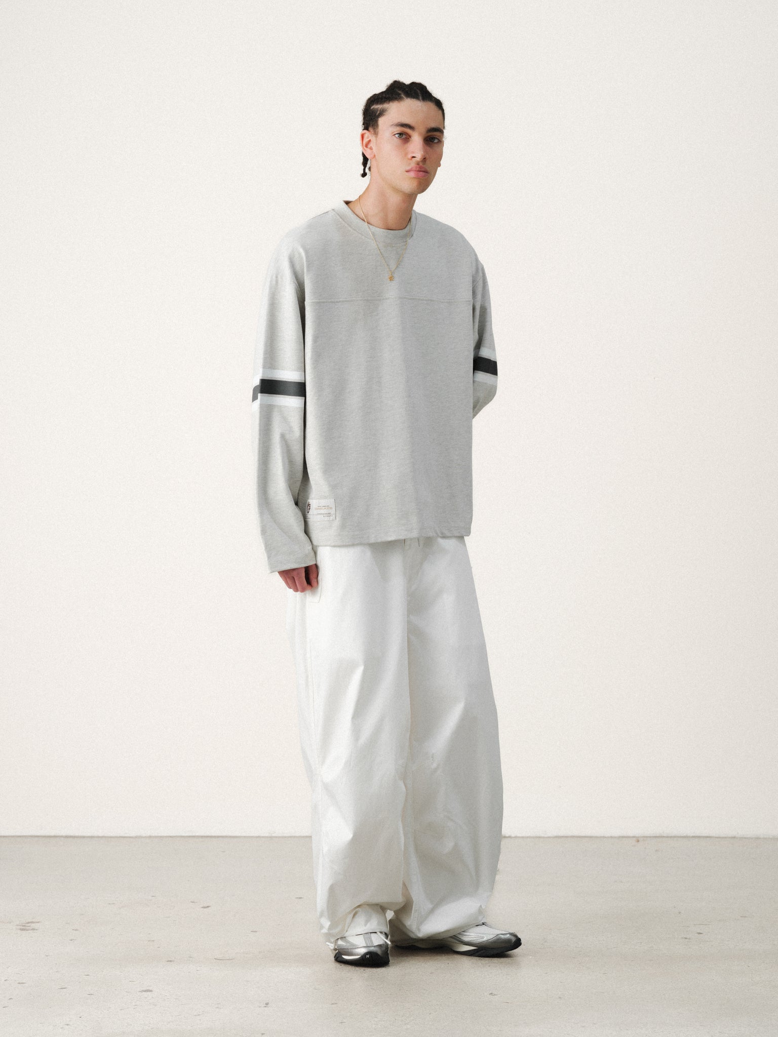 White V3 Flight Pant by Sweats EU, showing the relaxed fit and quality fabric detail on a summer day.