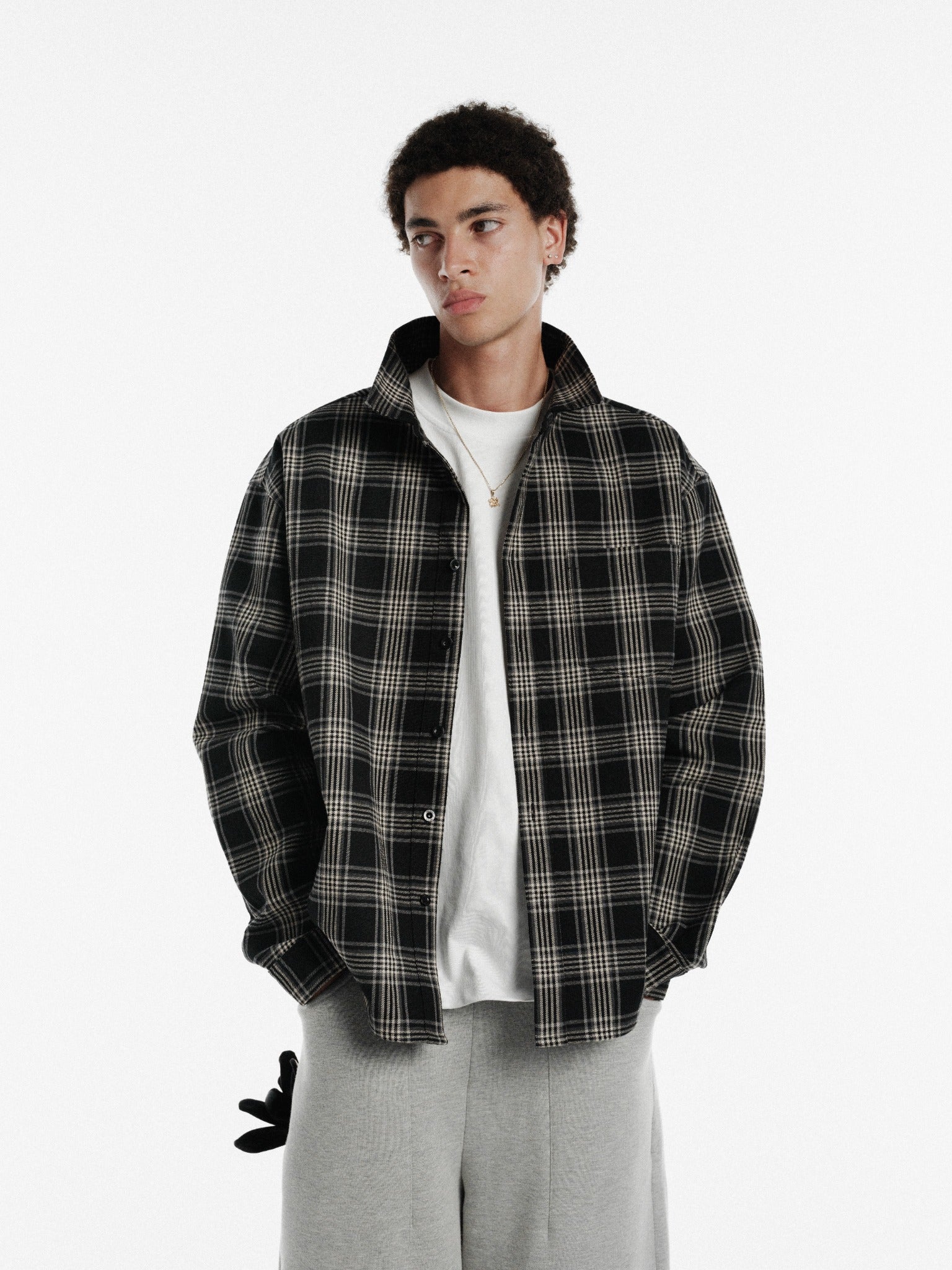 Black flannel long-sleeve shirt by SWEATS EU, featuring a classic button-up design and soft fabric for casual wear.