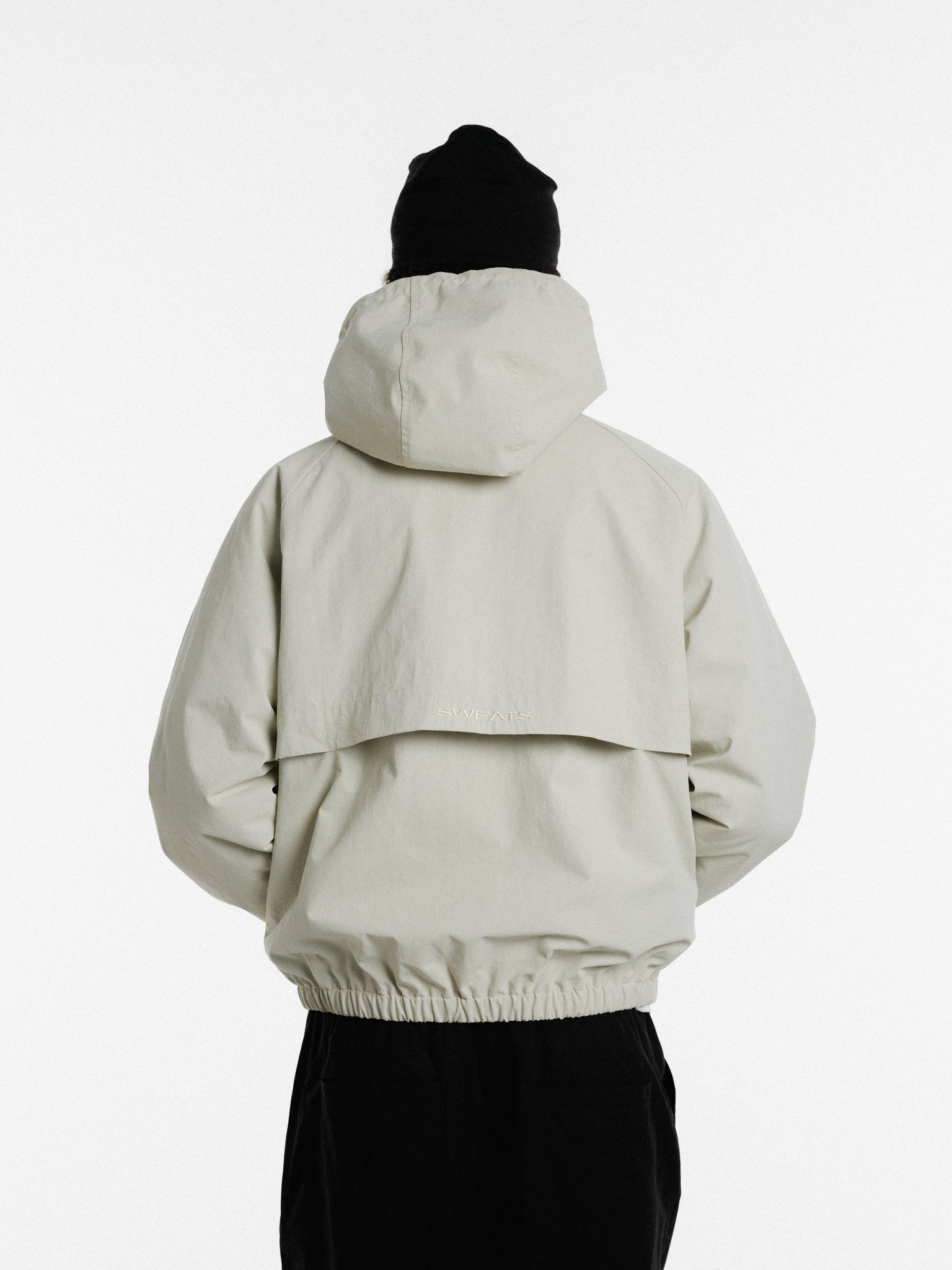 Stone-colored ARC jacket by SWEATS EU, featuring a stylish winter design and comfortable fit, shown in the product image.