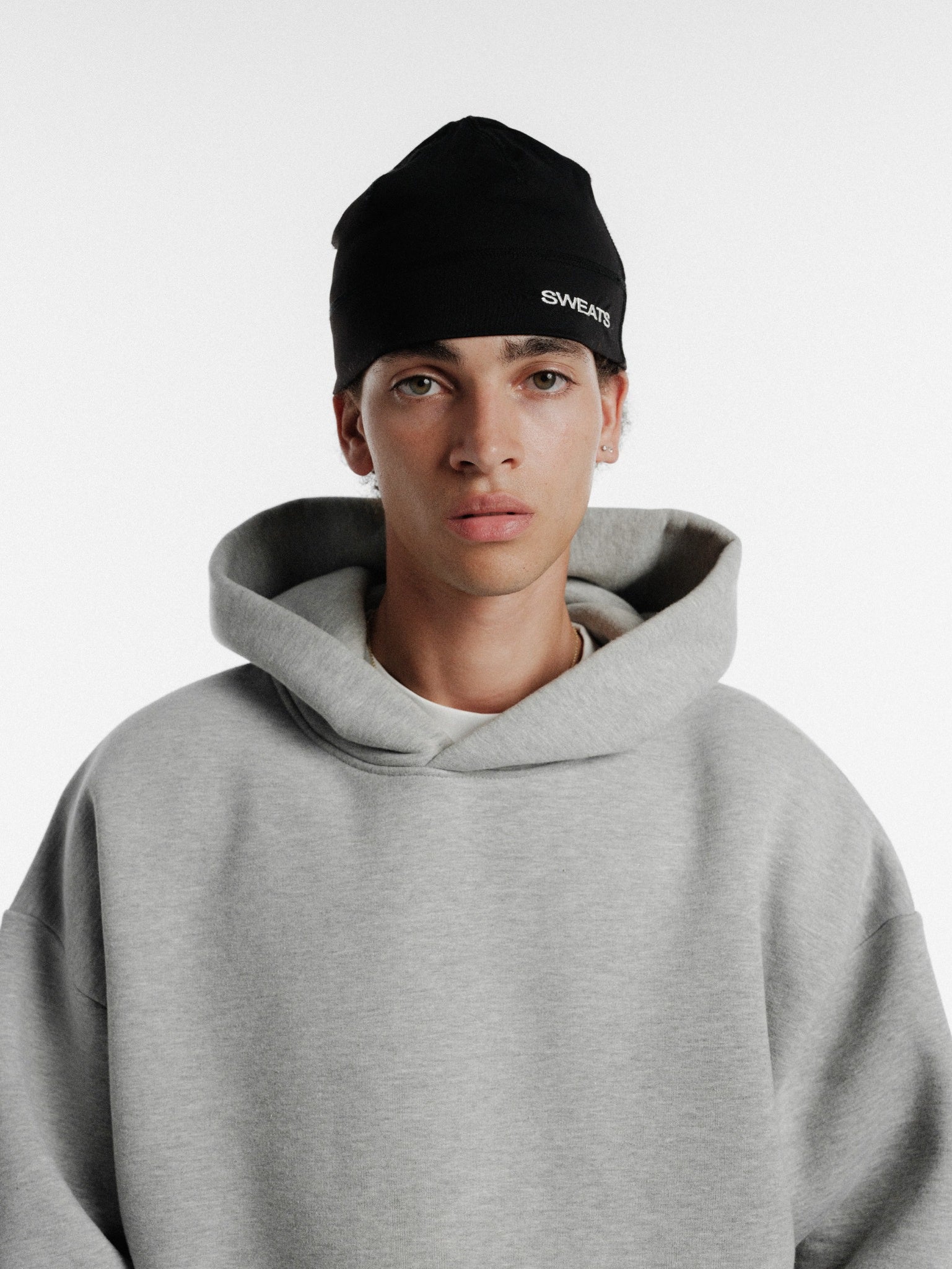Black SPORTSKULLY from SWEATS EU, a winter sports skull cap with a sleek design and comfortable fit.
