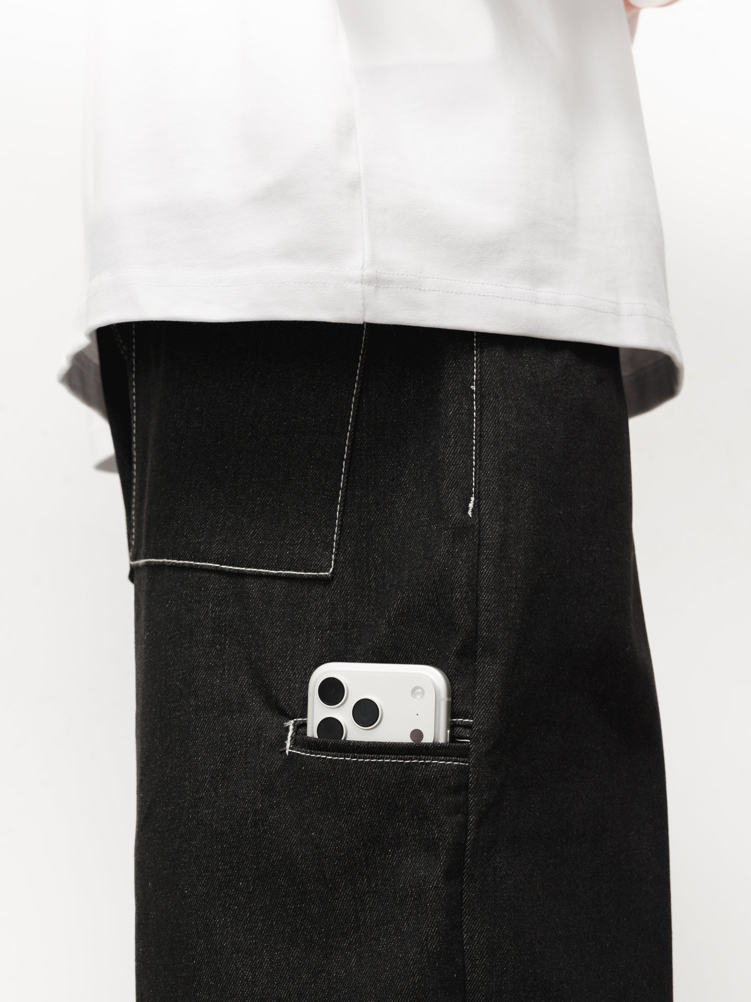 Black denim baggy jeans by SWEATS EU, shown as full-length shot highlighting relaxed fit and classic style.