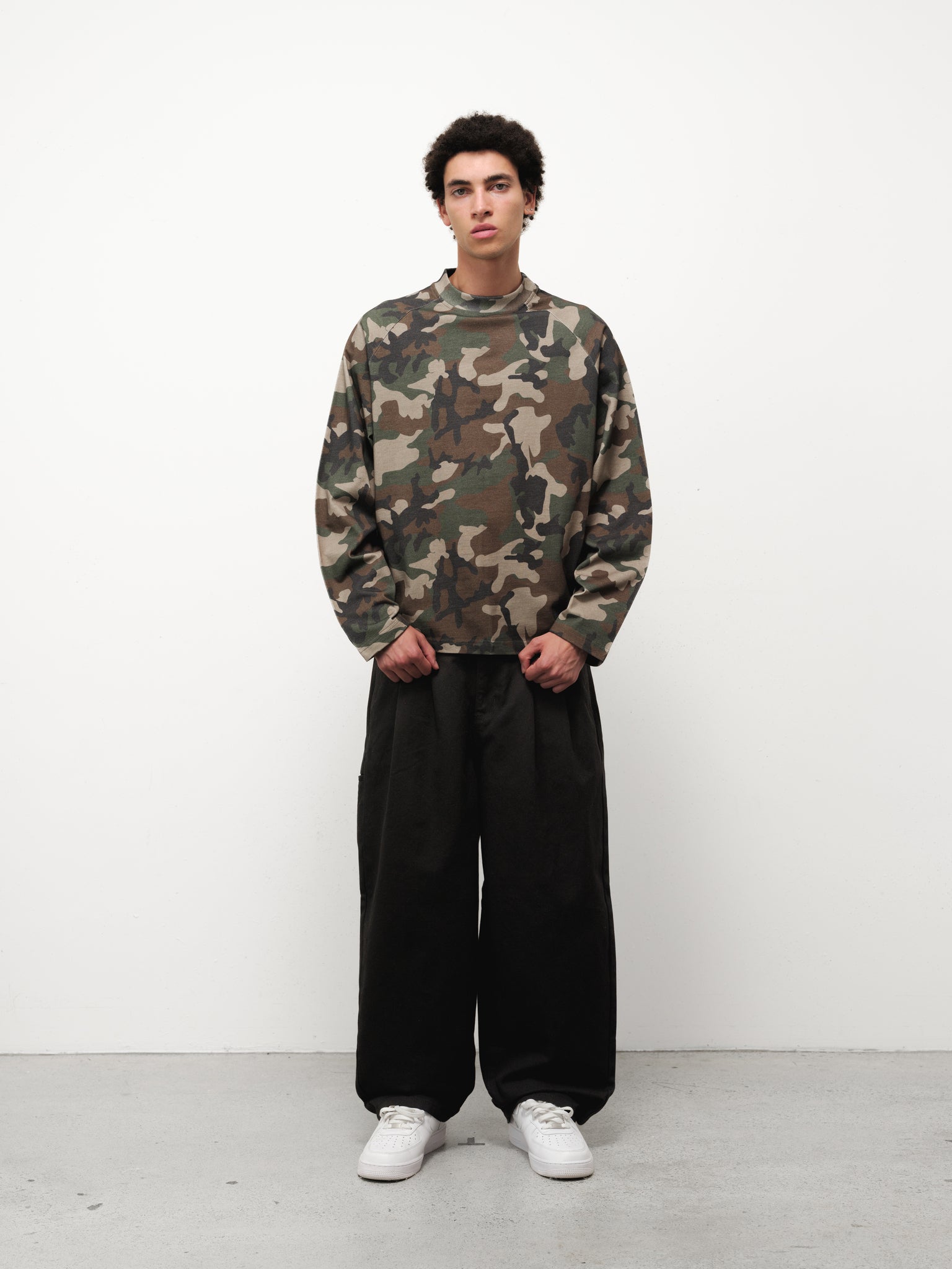 Long sleeve camo T-shirt by SWEATS EU, featuring a fitted design and camouflage pattern on soft fabric.
