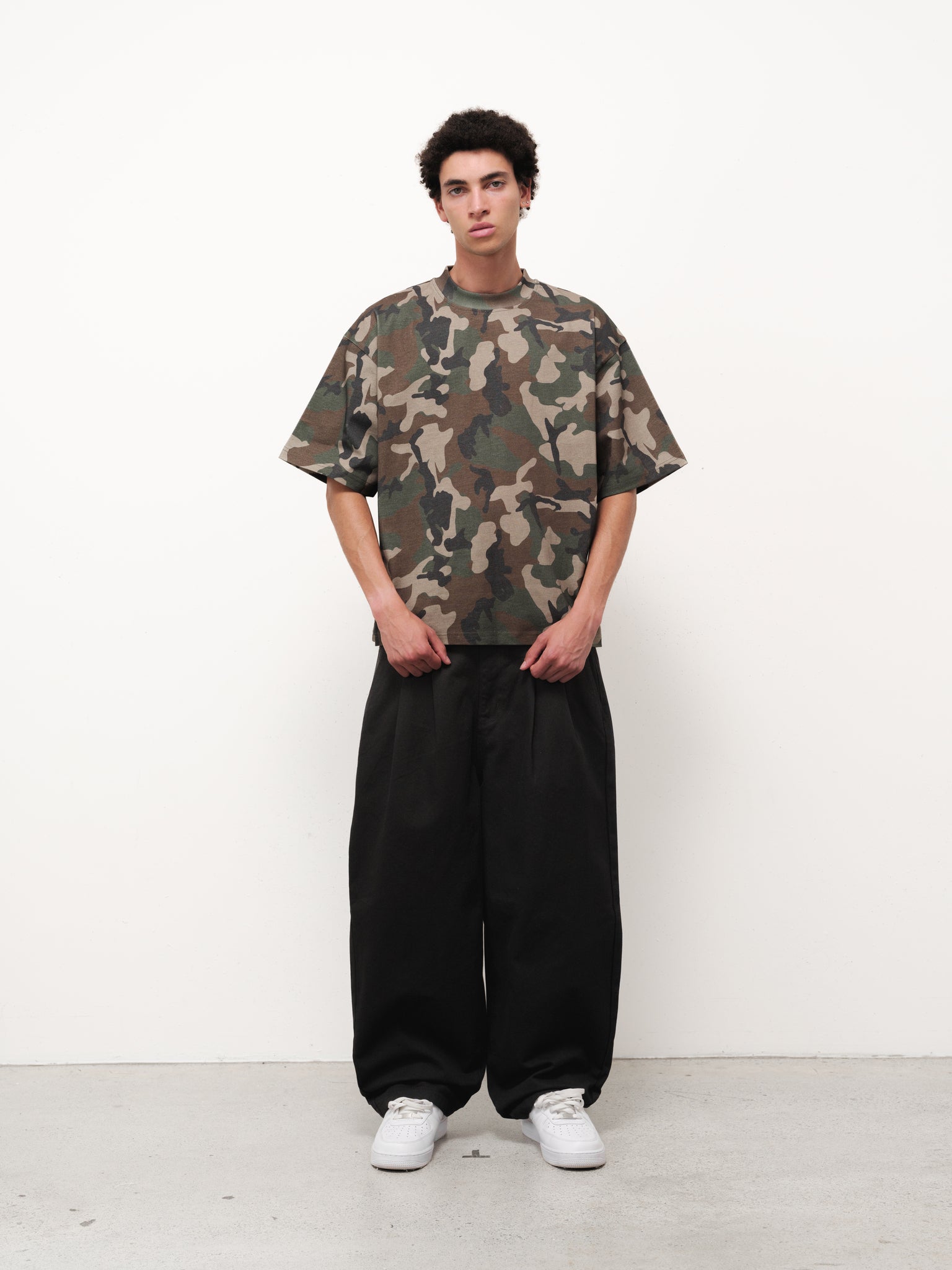 Signature blank camo T-shirt by SWEATS EU displayed on a mannequin with a camouflage print and casual fit.