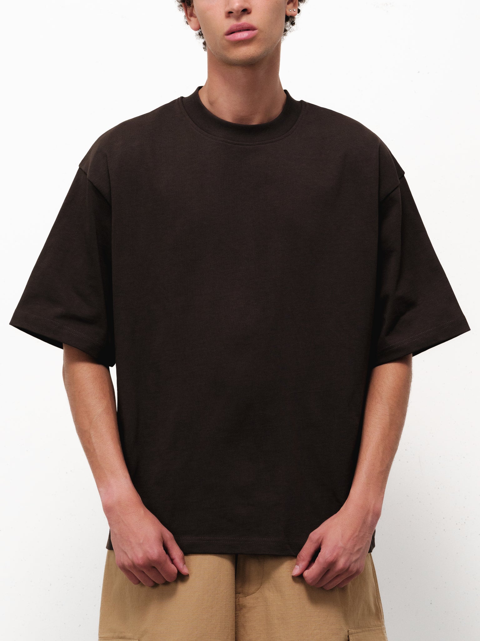 Sweats EU Signature Blank Coffee T-shirt displayed on a hanger, showcasing a casual, comfortable unisex cotton tee.