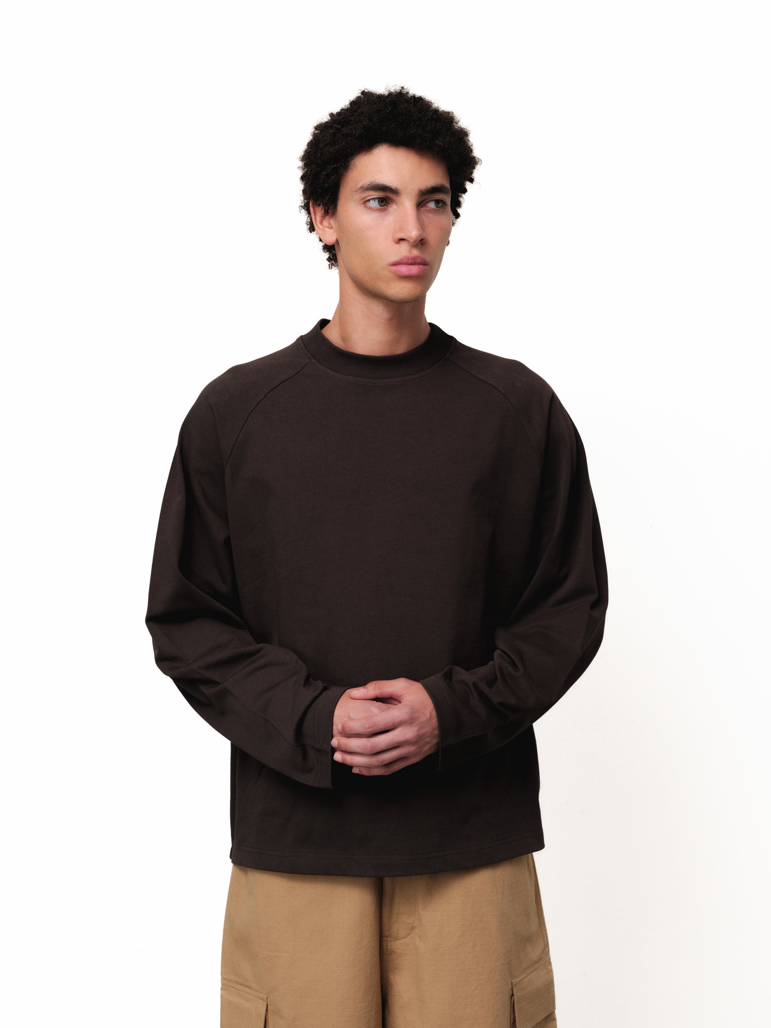 Long sleeve coffee-colored T-shirt by Sweats EU displayed on a model, showcasing casual style and comfortable fit.