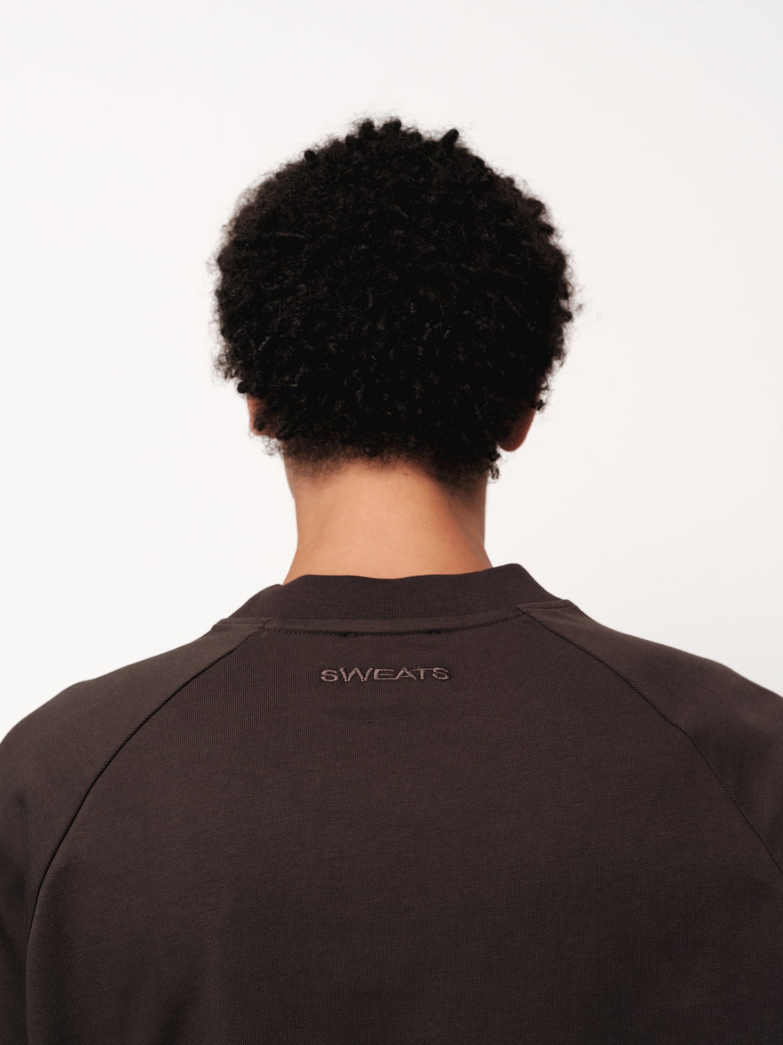Long sleeve coffee-colored T-shirt by Sweats EU displayed on a model in a full stock shoot.