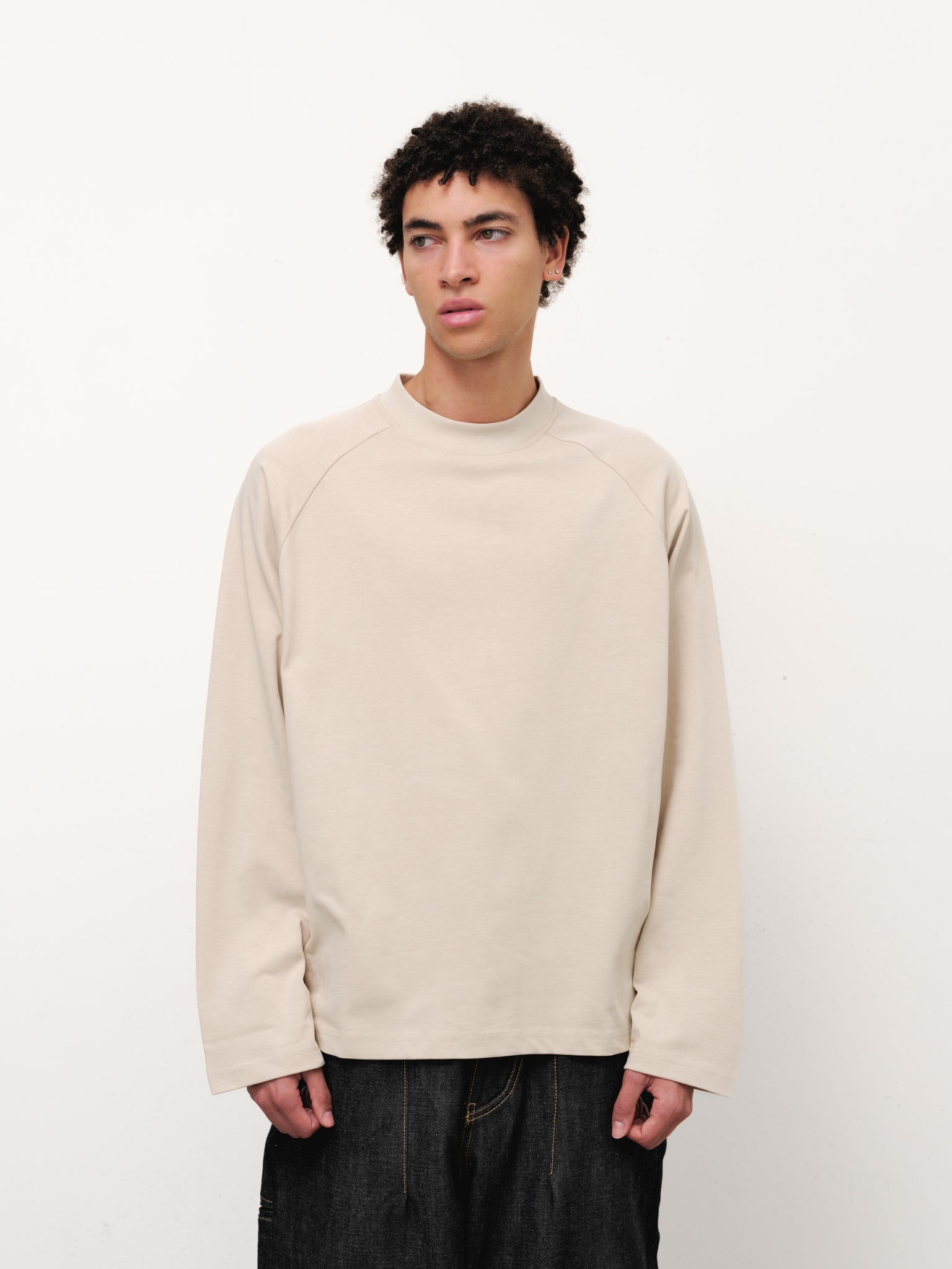 Long sleeve oat-colored T-shirt by Sweats EU displayed on a model, showcasing casual style and comfortable fit.