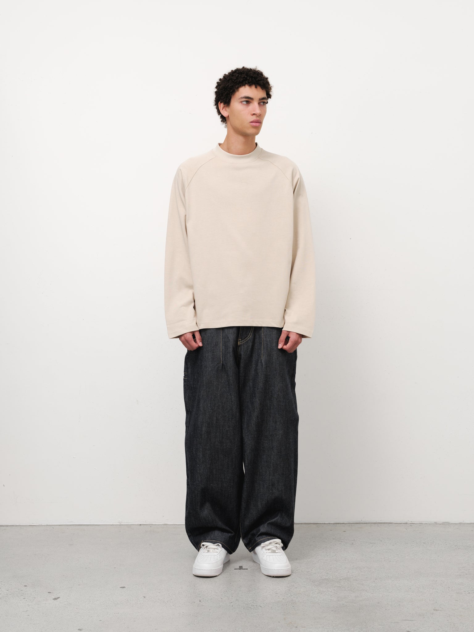 Long sleeve oat-colored T-shirt by Sweats EU, displayed on a model, showcasing casual comfort and stylish fit.