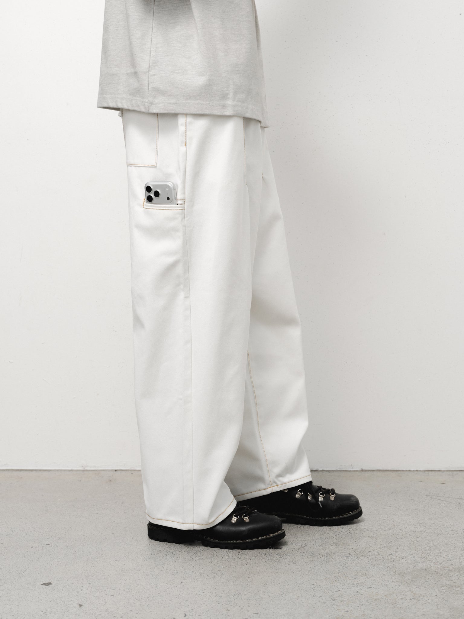 White denim baggy jeans by SWEATS EU, shown in a full-length shot highlighting relaxed fit and casual style.