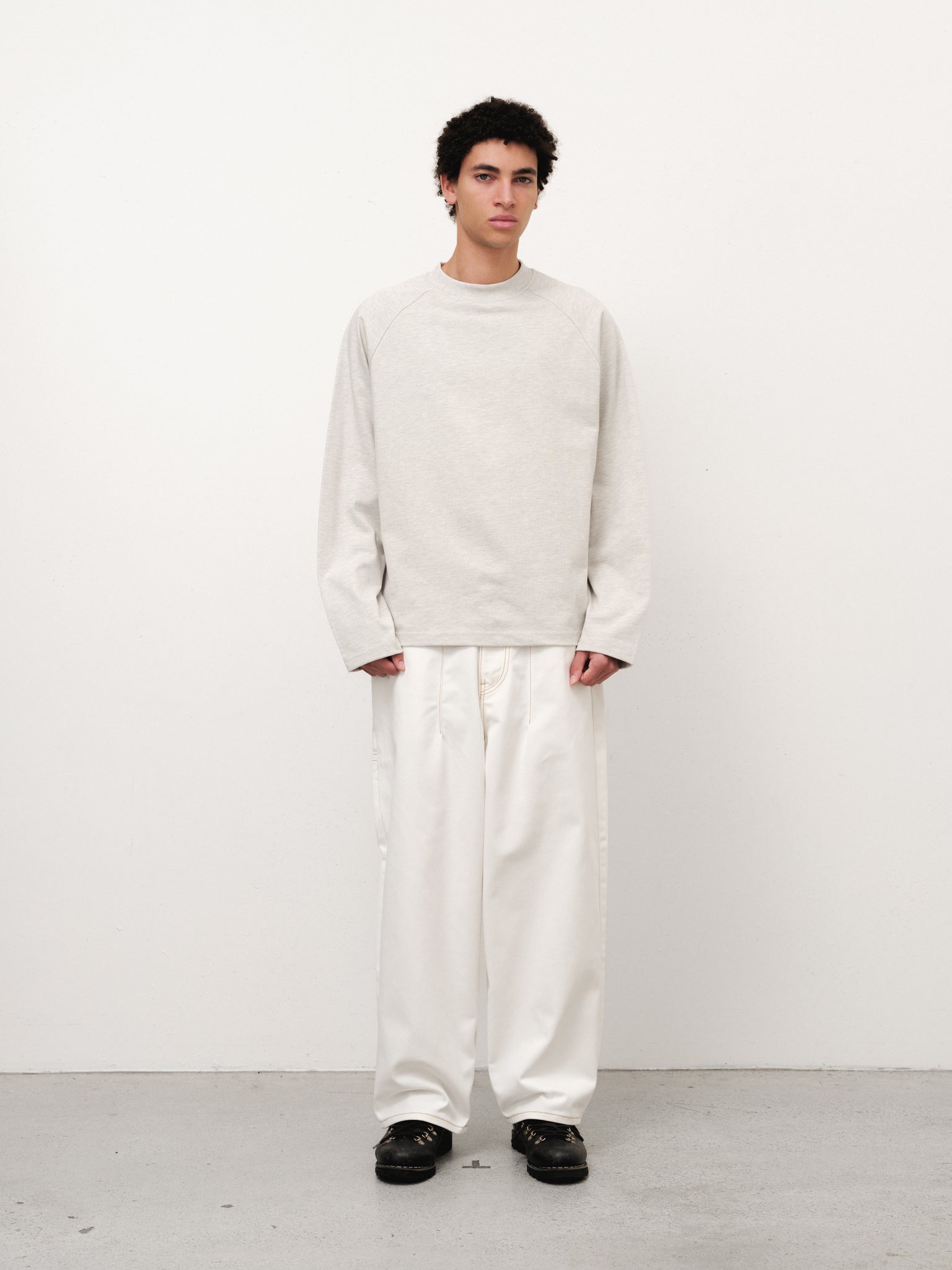 White denim baggy jeans by Sweats EU, full-length view showcasing relaxed fit and casual style.