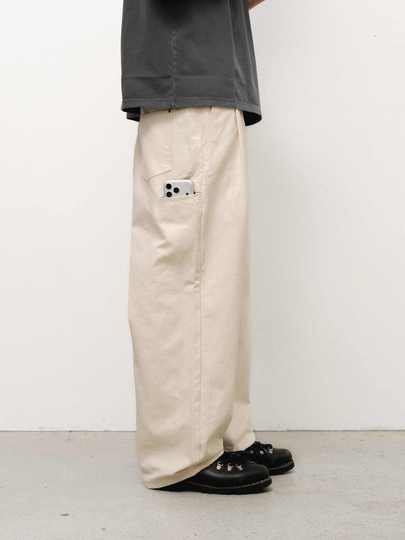 Ecru workwear pants by Sweats EU shown in full view, featuring durable fabric and relaxed fit for industrial or casual wear.
