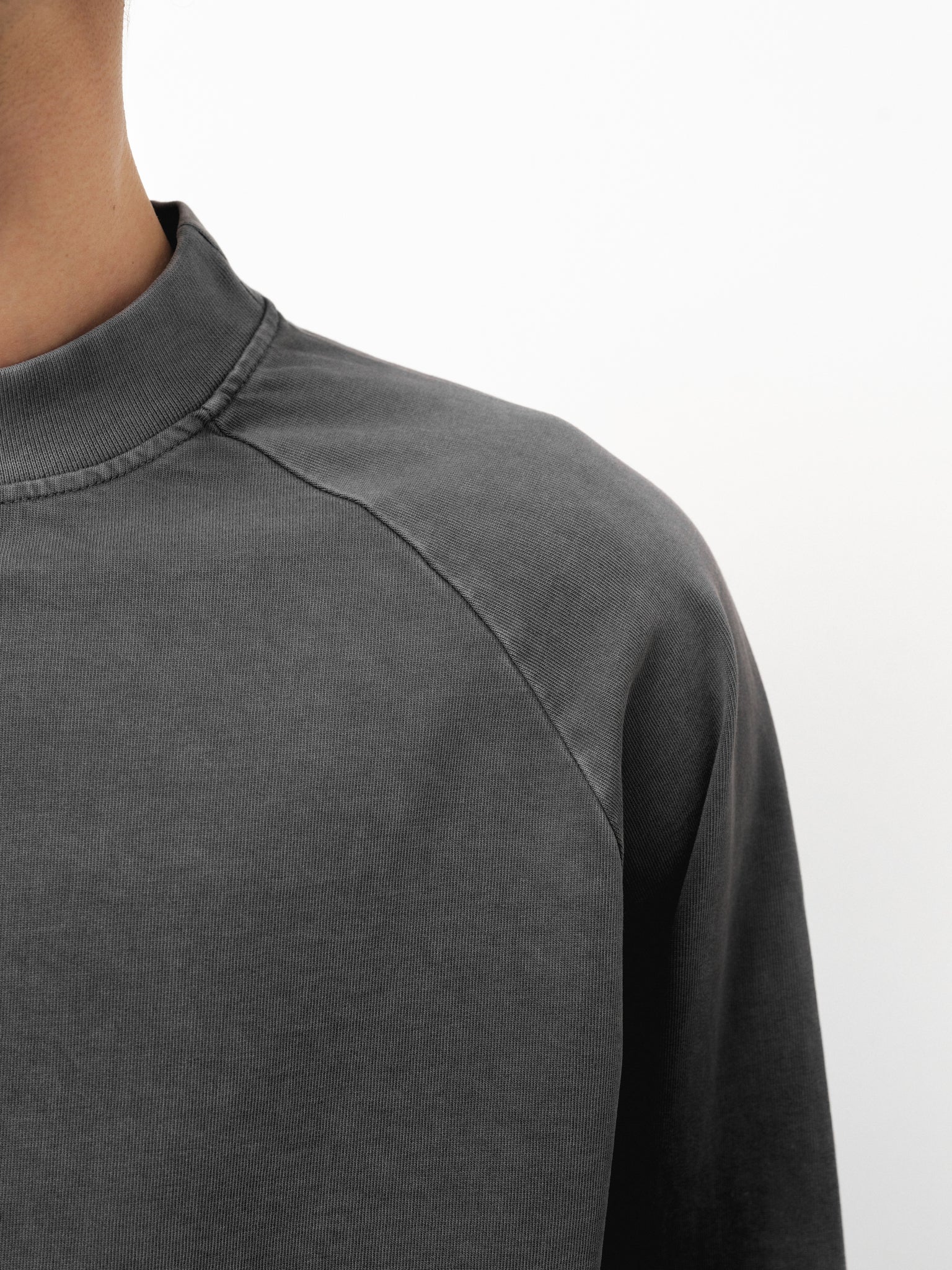 Washed grey long sleeve T-shirt by Sweats EU displayed on a full stock shoot with fabric details and casual fit.