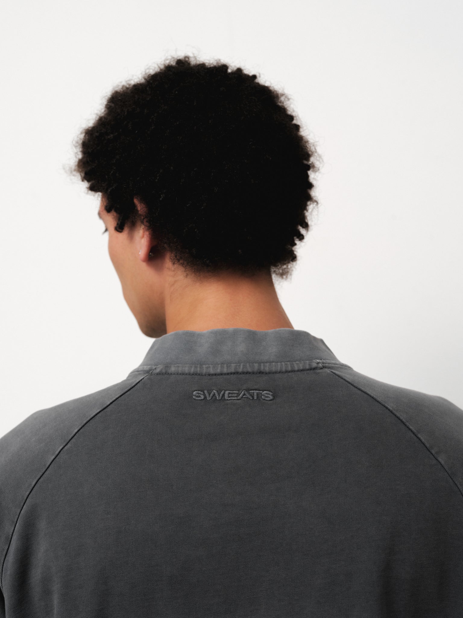 Long sleeve T-shirt in washed grey from Sweats EU, showing a relaxed fit and soft fabric texture.