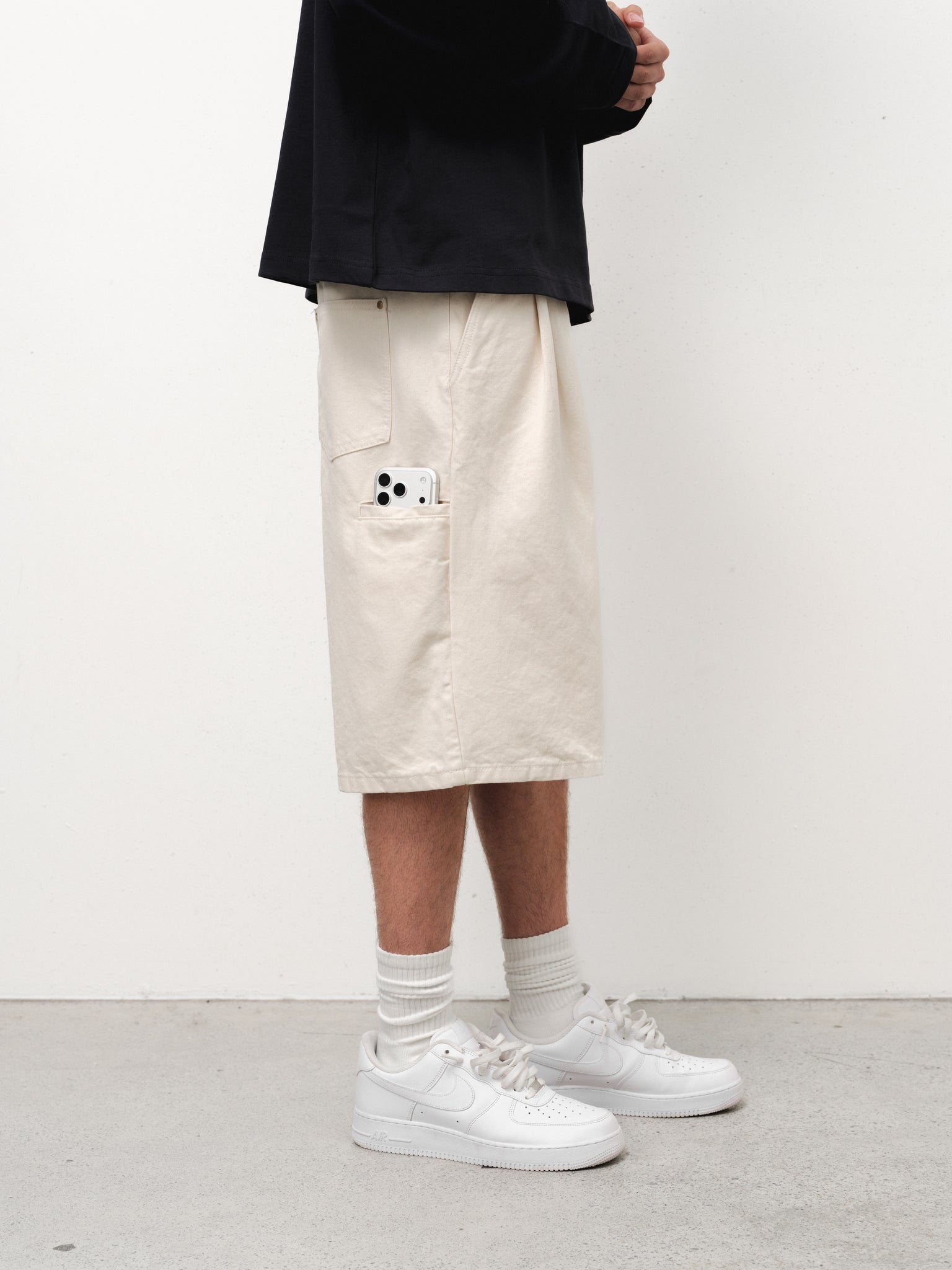 Ecru workwear shorts by SWEATS EU, front view showing durable fabric and relaxed fit, suitable for industrial or casual work settings.