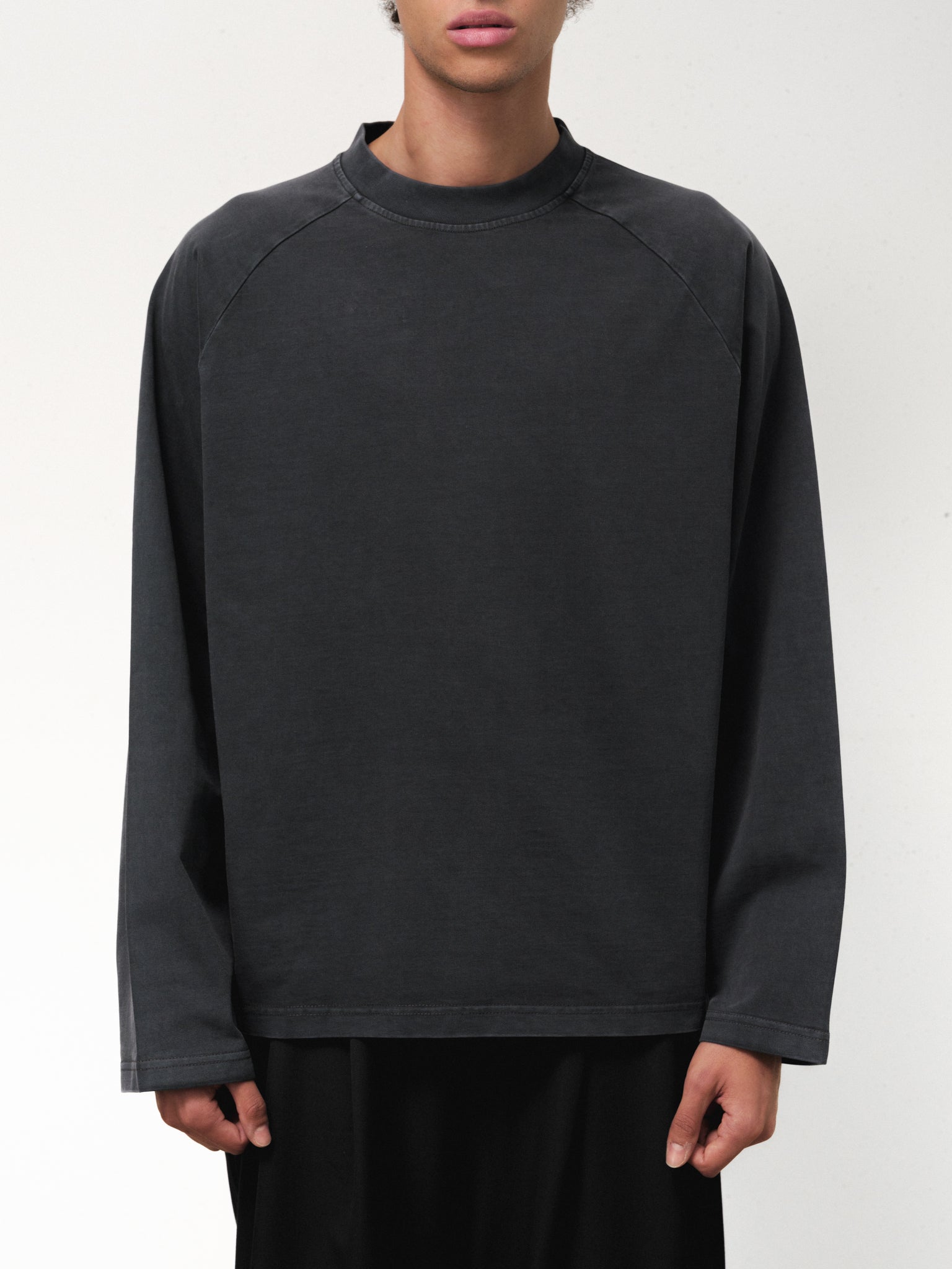 Sweats EU long sleeve T-shirt in washed black fabric, displayed on a mannequin with a casual fit and soft textured material.