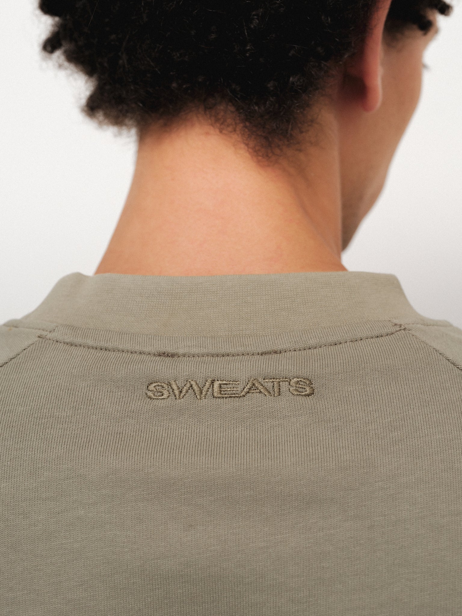 Sage long sleeve T-shirt by SWEATS EU, featuring a comfortable fit and casual style, shown on a plain background.