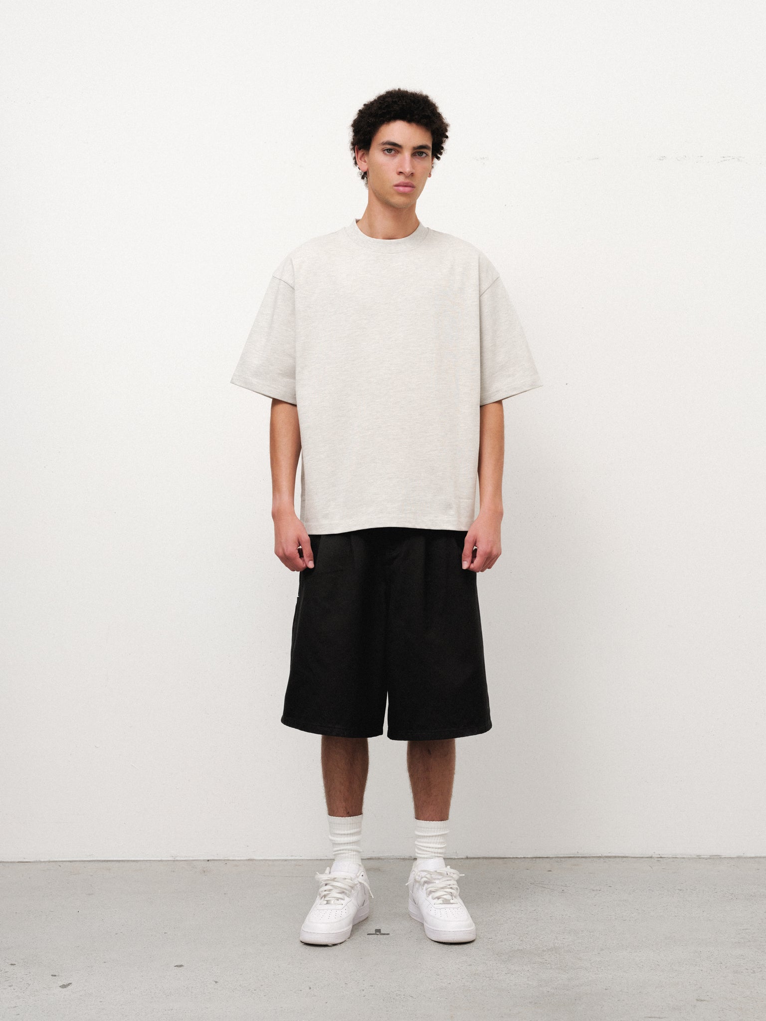 White SIGNATURE BLANK T-shirt by SWEATS EU, displayed on a full-body mannequin, showcasing a casual fit and simple design.