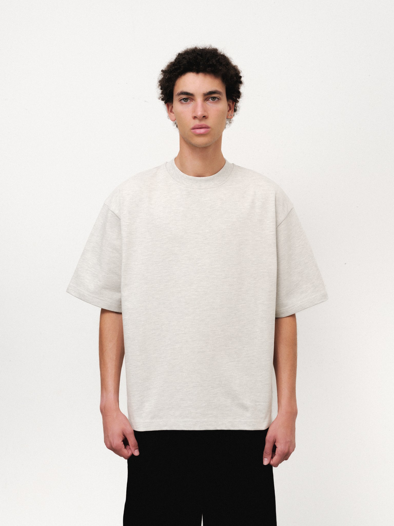 White Signature Blank T-shirt from SWEATS EU featuring a classic fit and soft cotton fabric, displayed on a hanger.