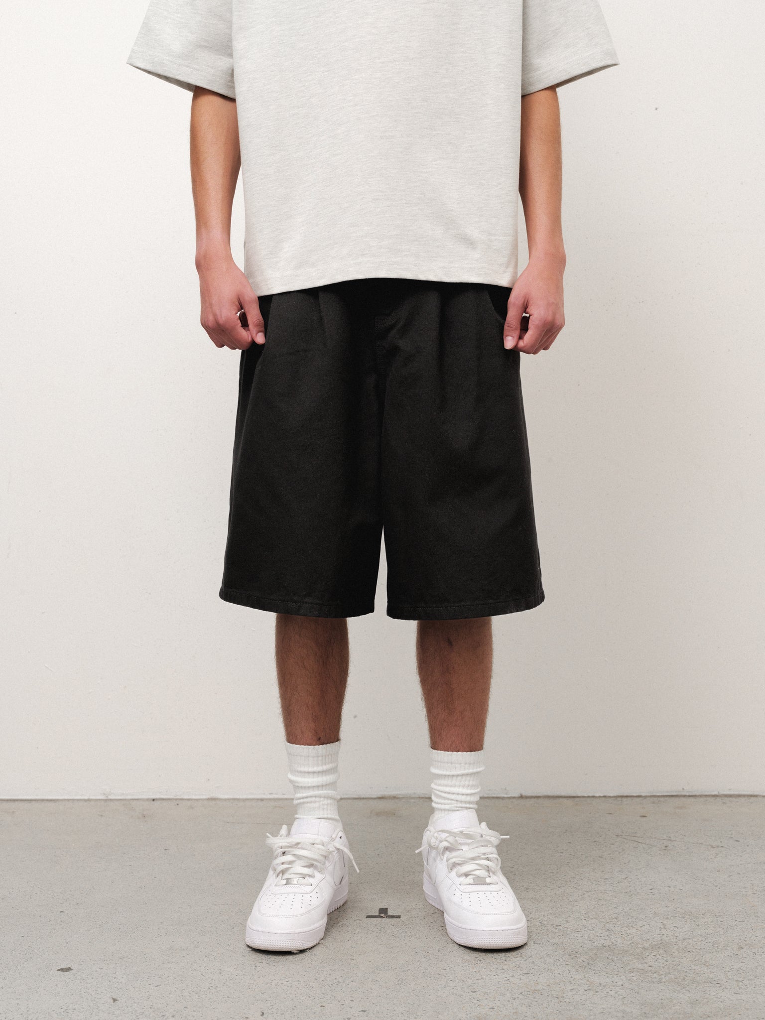 Black workwear shorts from SWEATS EU, showcasing durable fabric and practical design for industrial or construction settings.
