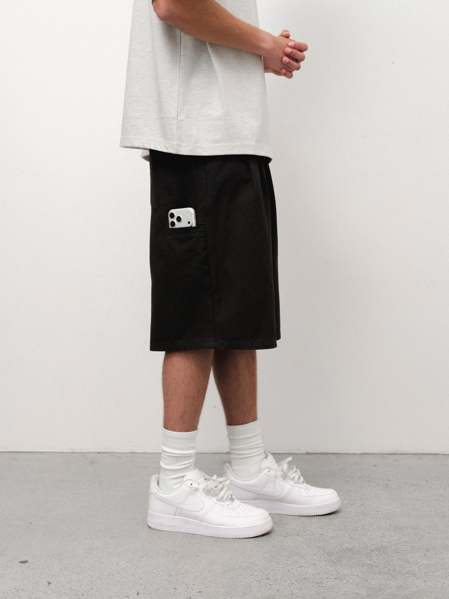 Black workwear shorts by Sweats EU, shown in full stock shot, featuring durable fabric and practical design for work environments.
