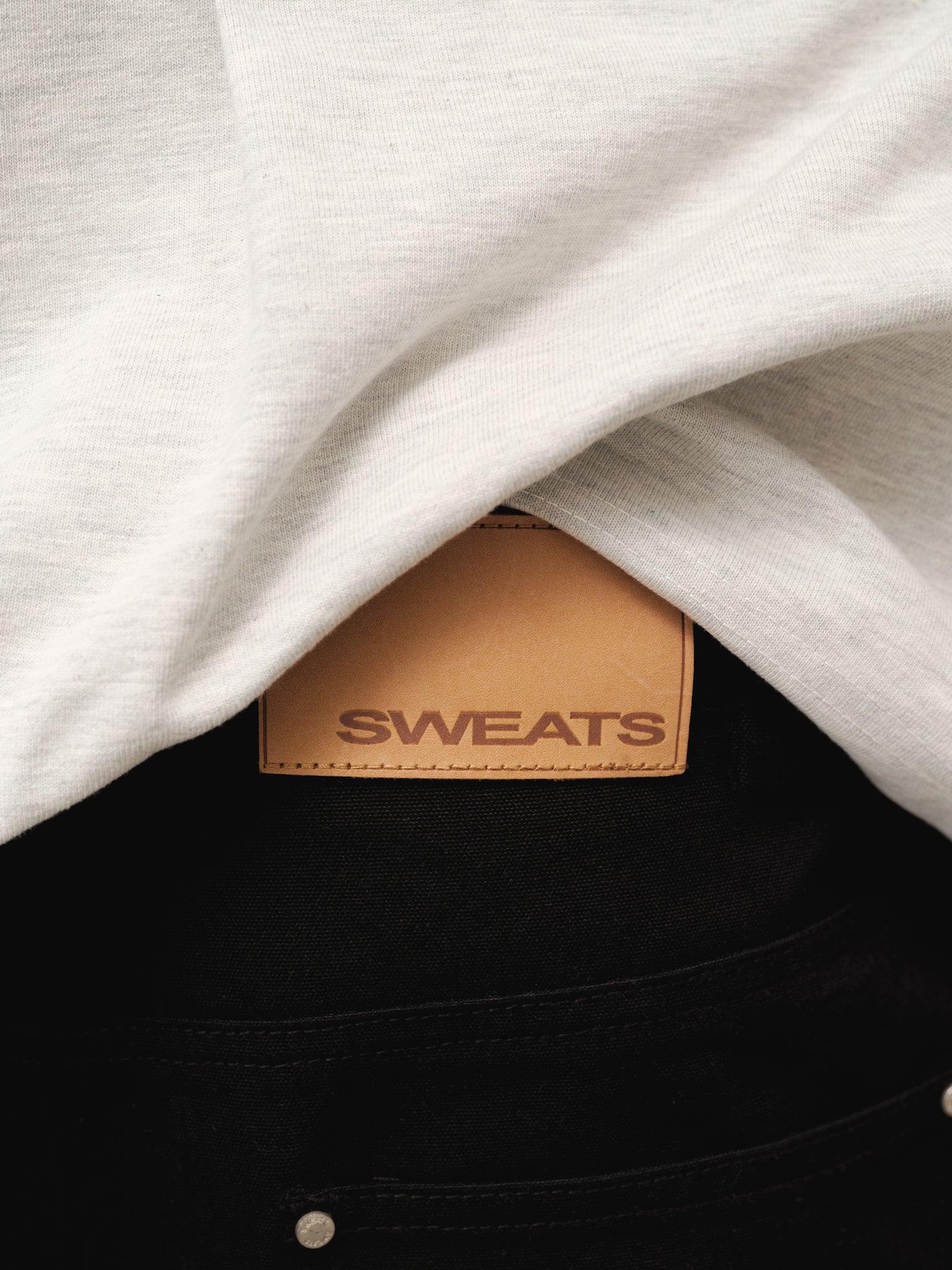 Black workwear shorts by SWEATS EU, shown in full-length with a focus on durable fabric and practical design for workwear.