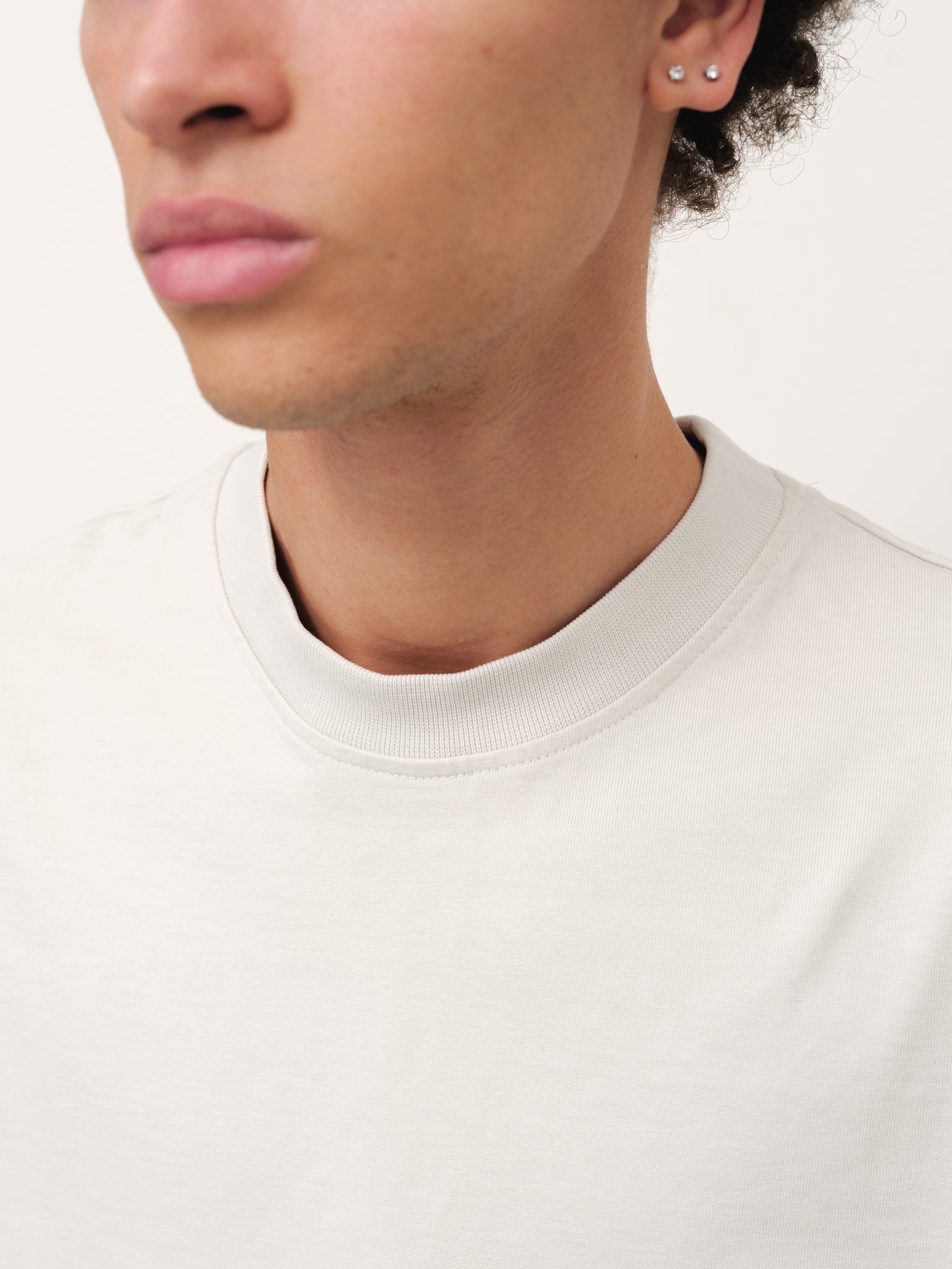 White Signature Blank T-shirt by SWEATS EU, front view showing classic crew neck and clean chalk color fabric.