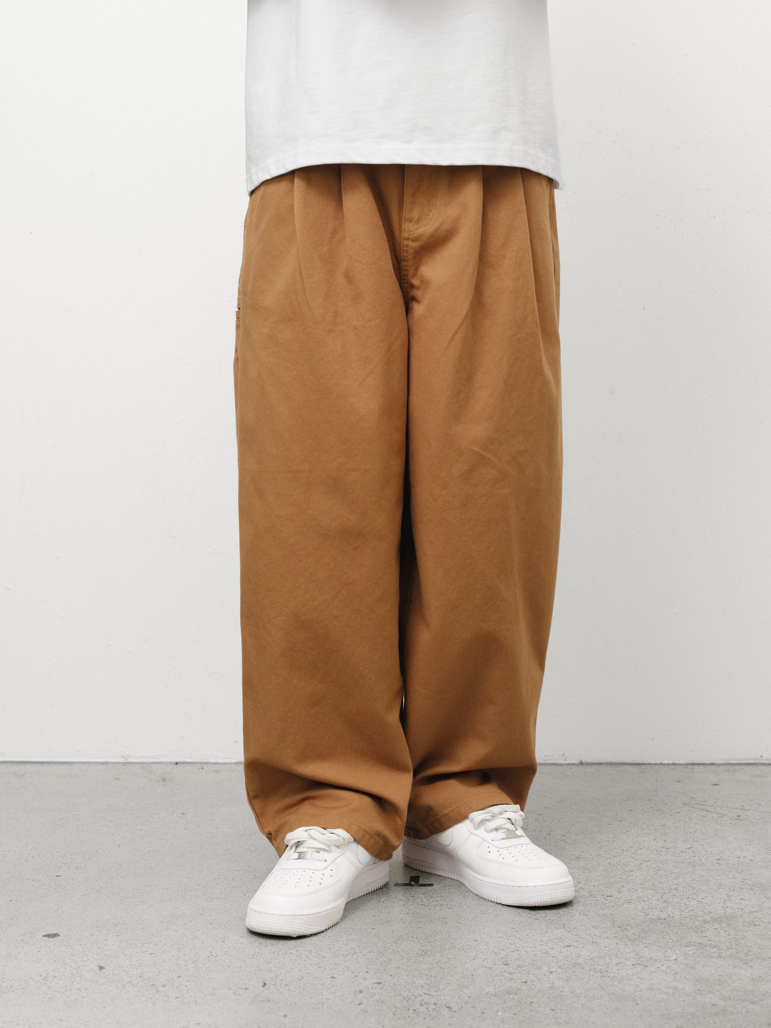 Tan workwear pants by SWEATS EU, full-length view showing durable fabric and practical design for industrial use.